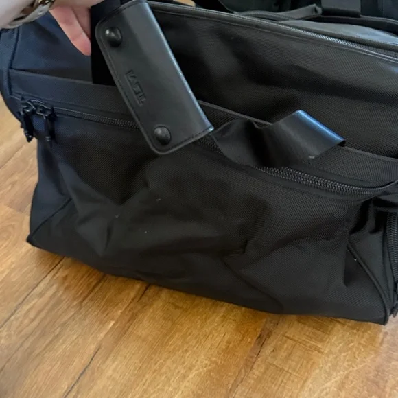 Tumi black travel bag/carryon